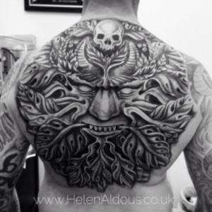 Green man back tattoo.